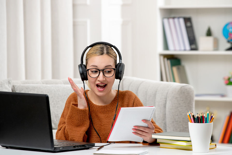 student-online-cute-girl-glasses-sweater-studying-computer-excited-about-her-notes (1).jpg