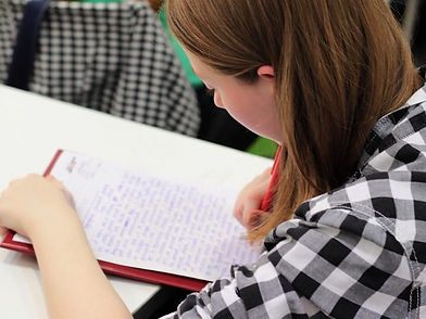 Hero-Student-Writing.jpg