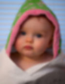 Baby with hooded towel on