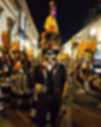 Wide angle view of a vibrant Día de Muertos parade