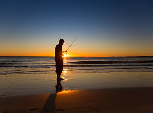 Beach fishing at sunrise on Bribie Island.
