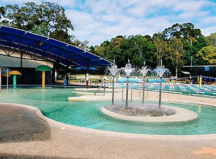 Large whirlpool with fountains, an Olympic-sized pool, and a kids’ water park play area.