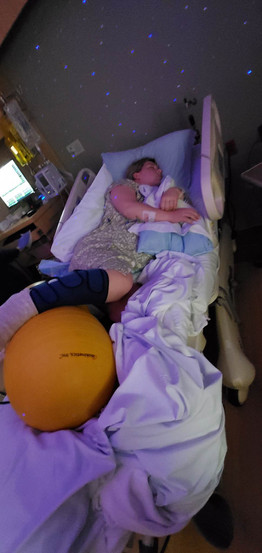 Brittni sleeping on her side with peanut ball between legs