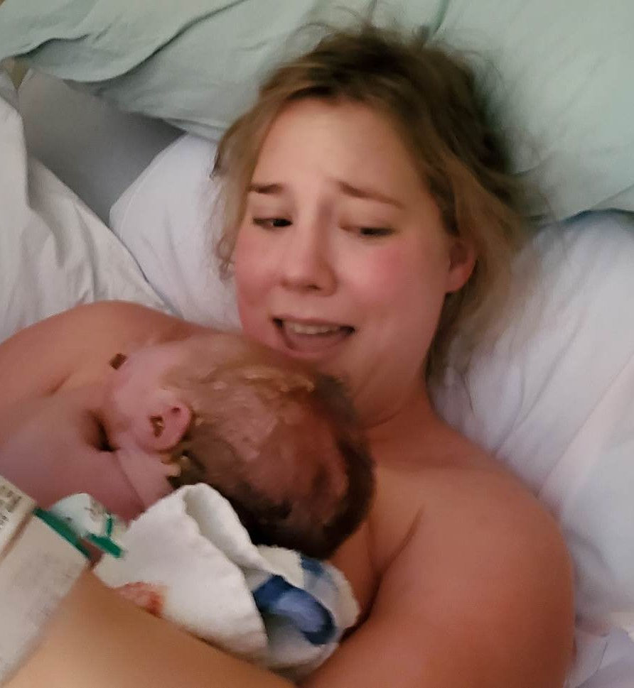 mom holding newborn for first time