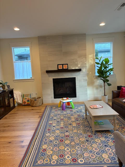This fireplace's biggest problem was its mantle. Not only was it too small, but it also didn't seem very strong. On top of that the tile surround did not fit with the rest of the home.