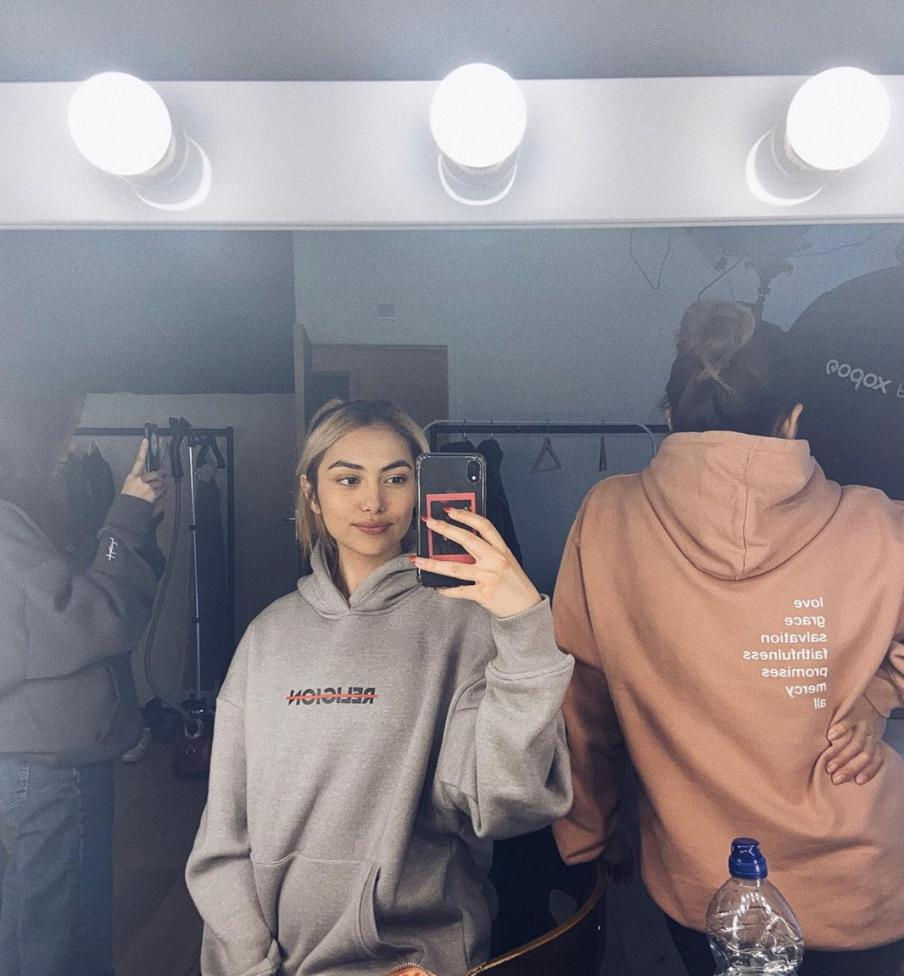 Marie wearing our Religion hoodie in dusty grey