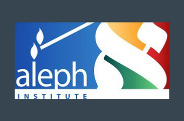 The Aleph Institute, headquartered in Surfside, Florida, is a Chabad-affiliated organization founded in 1981 to serve the religious, emotional, and practical needs of Jews in institutional settings. Its core mission encompasses supporting incarcerated individuals, military personnel, and their families, with a strong emphasis on preserving Jewish identity and dignity in challenging environments.
Aleph’s prison programs include regular rabbinical visits, Torah study, and the provision of religious materials such as tefillin, kosher food, and holiday supplies. The organization also advocates for inmates’ religious rights and facilitates compassionate release and clemency efforts. Reentry services offer job placement assistance, housing support, and life skills training, helping former inmates reintegrate into society while maintaining their Jewish observance.
For Jewish members of the U.S. Armed Forces, Aleph provides spiritual support through chaplaincy services, holiday packages, and moral guidance. The organization also works with military leadership to ensure that Jewish service members can observe religious practices, even while deployed.
Aleph’s family services extend to those with loved ones in prison or the military, offering emotional counseling, financial aid, and programs like Project Shifra, which connects families to resources for managing stress, legal aid, and household needs. The institute also runs alternative sentencing programs, advocating for rehabilitative justice models that allow nonviolent offenders to remain with their families while engaging in structured moral and educational development.