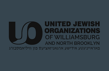 The United Jewish Organizations of Williamsburg and North Brooklyn (UJO) provides a broad range of social services for individuals and families, with a primary focus on advocacy, access to government programs, and community support. It serves as a liaison between the Orthodox Jewish community and government agencies, helping residents navigate bureaucratic systems and secure necessary services. The organization also represents community interests in public affairs, often advocating for resources and accommodations that address local needs.
UJO operates as a Family Preservation Center, offering hands-on assistance with benefit applications, such as food stamps (SNAP), Medicaid, housing, and other social service programs. Staff and volunteers help clients fill out forms, understand eligibility requirements, and follow through with required documentation. The organization also provides referrals and coordination with outside nonprofits and city agencies to ensure individuals receive complete support.
In addition to individual casework, UJO plays a central coordinating role for more than 200 local charities, civic associations, and community institutions. It supports organizational collaboration, helps secure funding, and advocates on behalf of neighborhood-wide initiatives affecting housing, health, safety, and education. Its staff works directly with city and state departments to address issues such as affordable housing, zoning, infrastructure, and security.