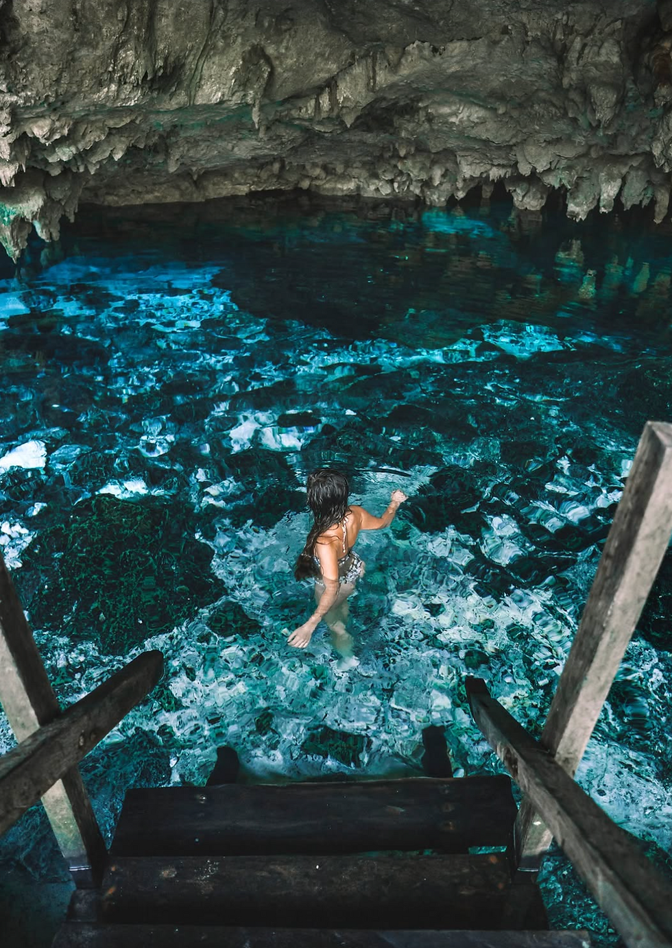 Woman swimming in a cenote