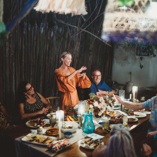 Woman toasting at birthday dinner