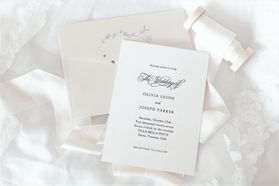 This is a simple and elegant black and white invitation with calligraphy and an old money look.