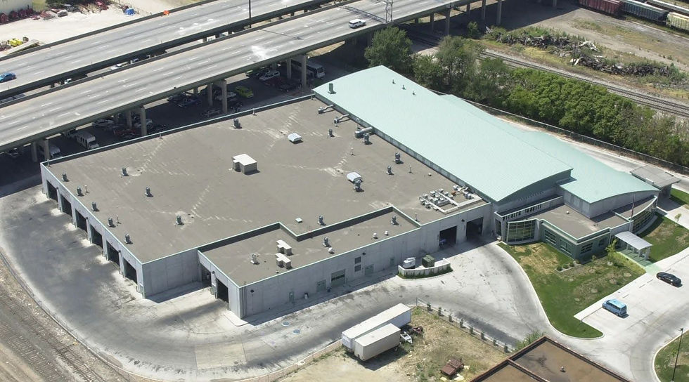 Arial shot of a large commercial building showing a flat roof