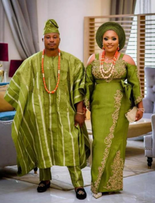 A couple wearing a handwoven fabric traditionally made from cotton or silk.