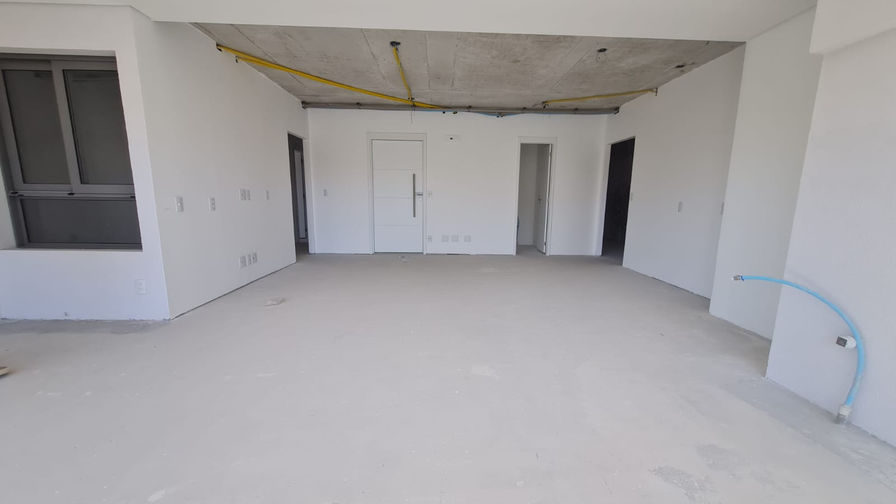 Living amplo do apartamento Mirante Ibirapuera com varanda integrada