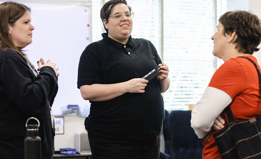Shelley talking to two people