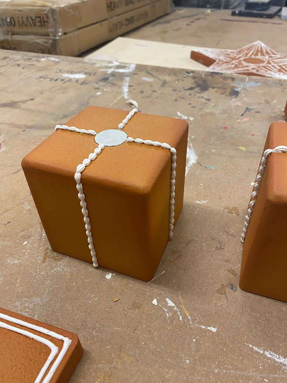 Piping boxes for the perfume to sit on.