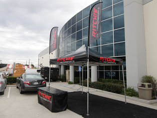 10x10 Custom Canopy Tents with Feather Branded Flags Ritchie Motorsports