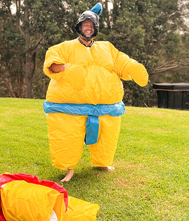 Adult in a sumo padded suit