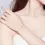 Thumbnail: simple silver bracelet, with a small sturdy silver heart in the middle, on a ladies wrist