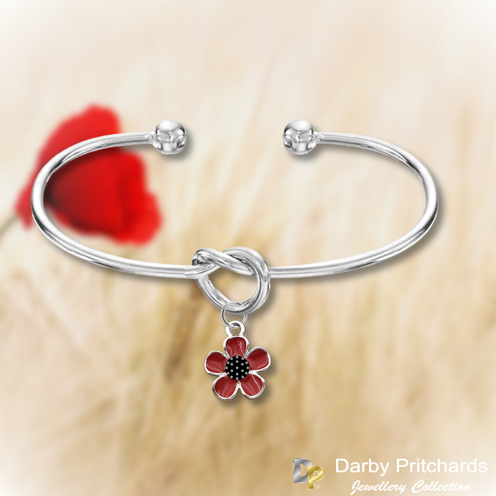 Thumbnail: Silver knot bangle with a hanging red and black poppy flower. On a Poppy background