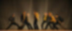 Seven men dancing on a rooftop