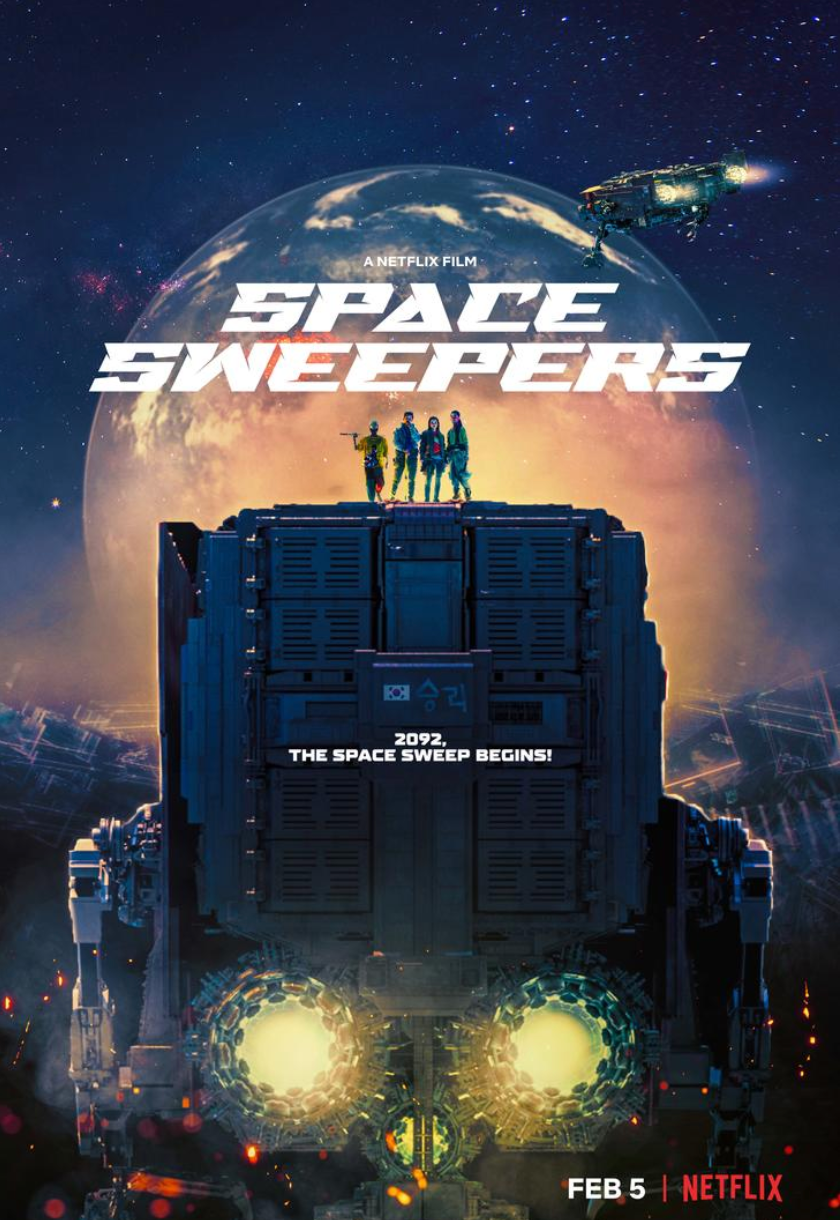 Four people standing on top of a space ship