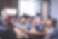 man standing in front of people sitting beside table with laptop computers_edited_edited.p