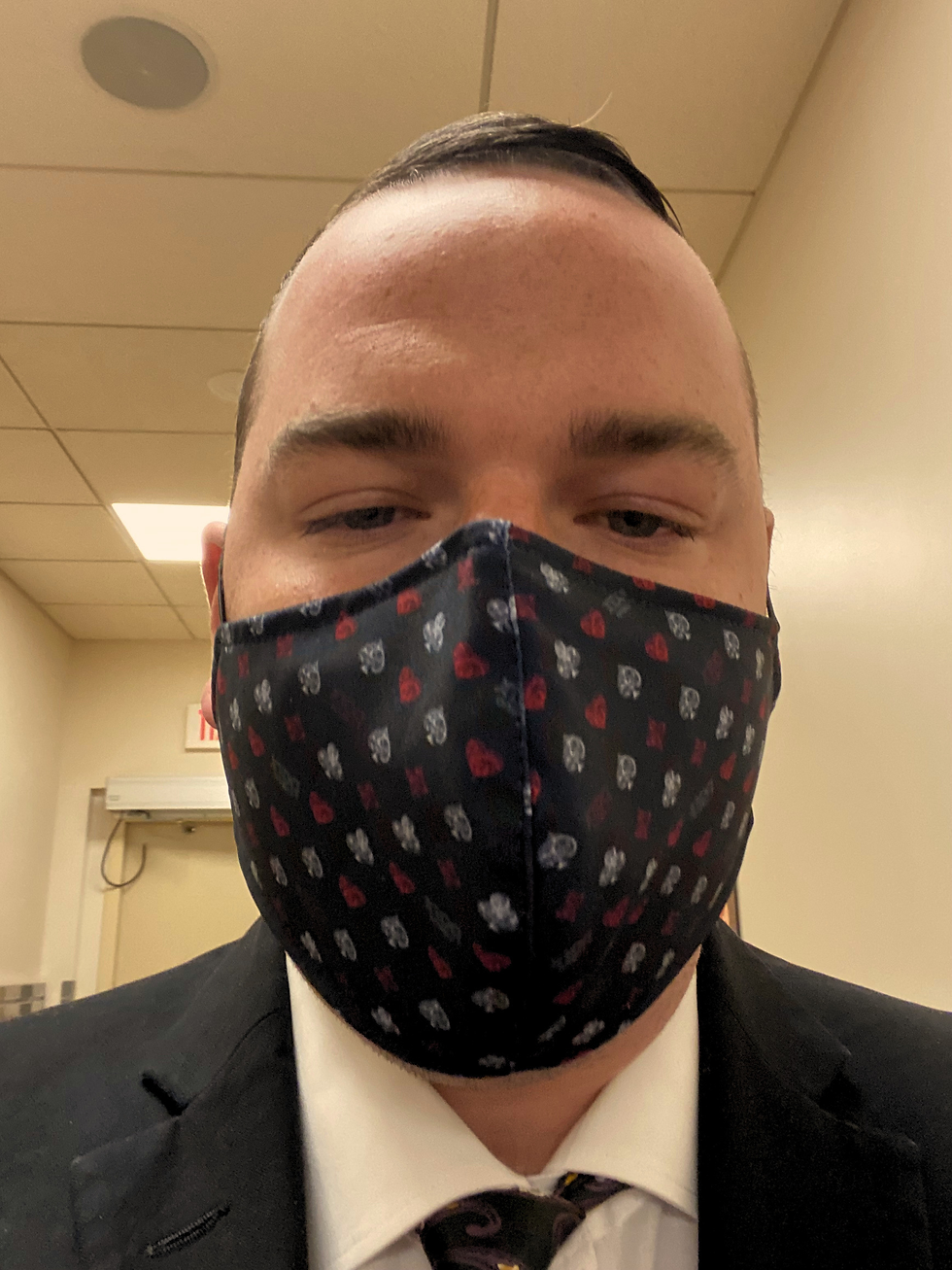 Range founder in suit and Covid mask during director operations.