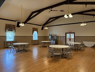 Alternate angle of tables and chairs displayed in the rental hall