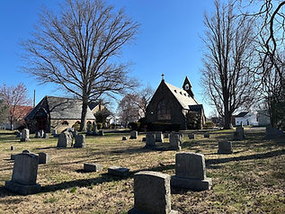 Wide angled Photo of the Memorial Church of St. Luke's historical cemetary with the Church Chapel in the background