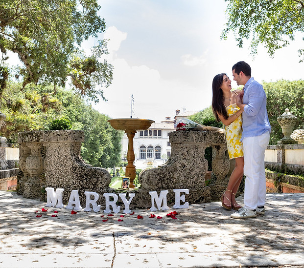 Couple celebrating their engagement at Vizcaya Musuem & Gardens, Miami, Fl