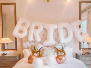 Miami bachelorette party décor featuring BRIDE balloon setup and ring balloons