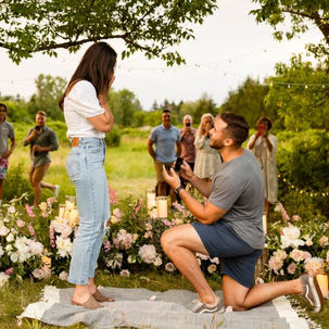 Newly engaged couple celebrating with family and friends at an elegant proposal party