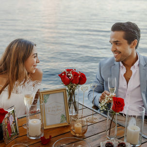 Engaged couple enjoying a romantic dinner at a Miami restaurant