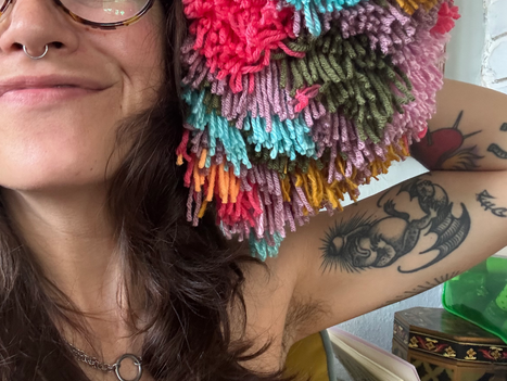 erin lowndes artist holding pompom