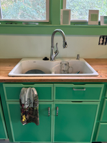 @SORTAKINDAOKAY sink with mint green cabinets