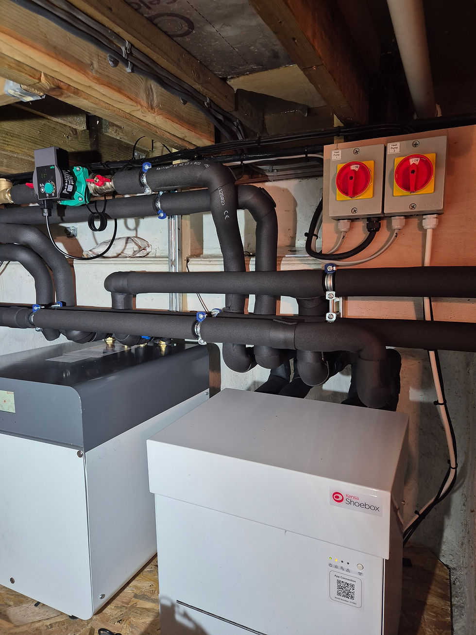 Close-up view of ground source heat pump pipes being installed in a garden