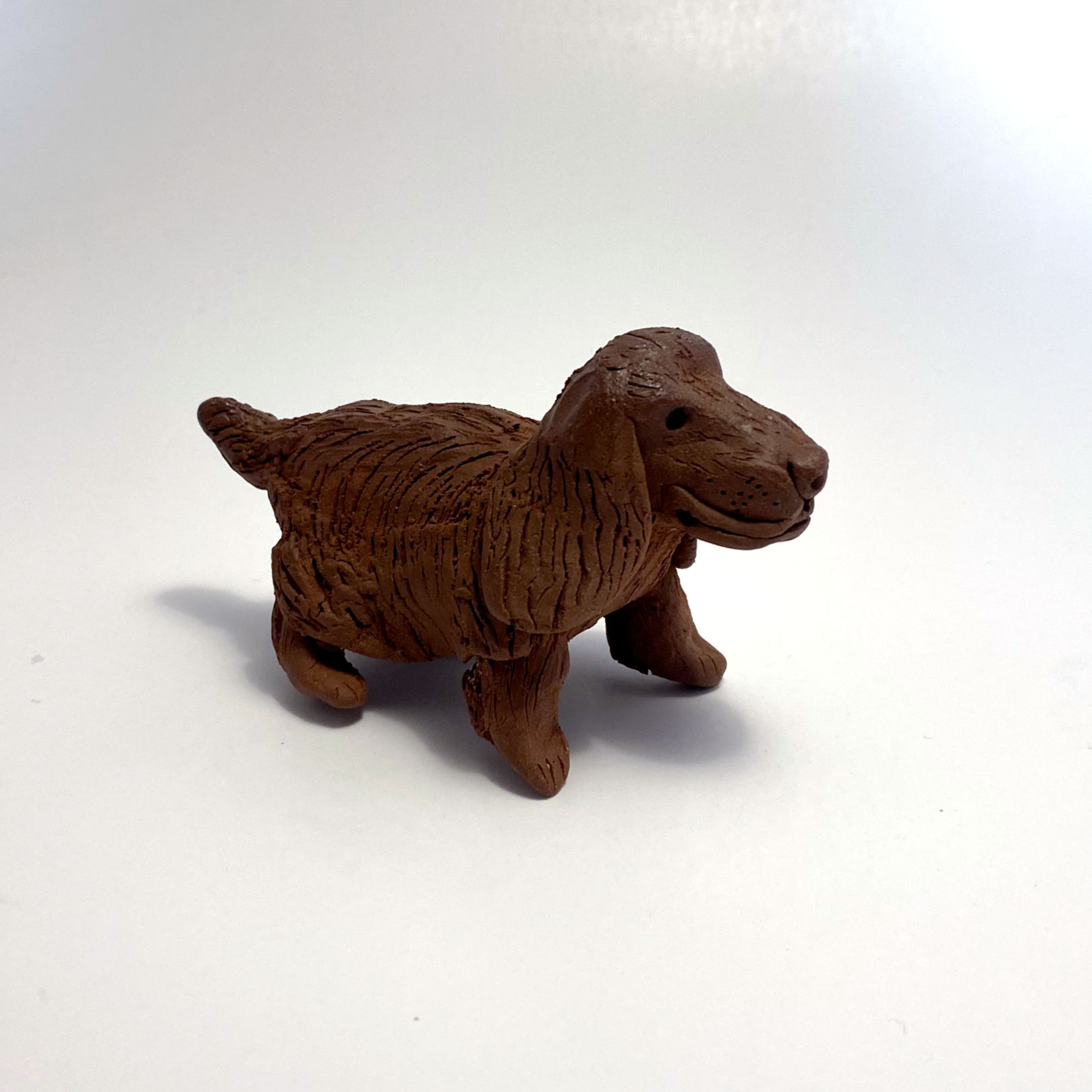 Large Brown Dog Figurine with Floppy Ears