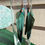 Thumbnail: black and aqua 5 1/2" long feather earrings