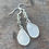 Thumbnail: teardrop earrings feature thick white Vieques sea glass and silver beads