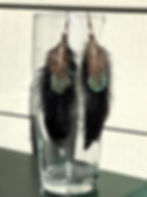 long feather earrings made with black turkey and green and teal pheasant feathers