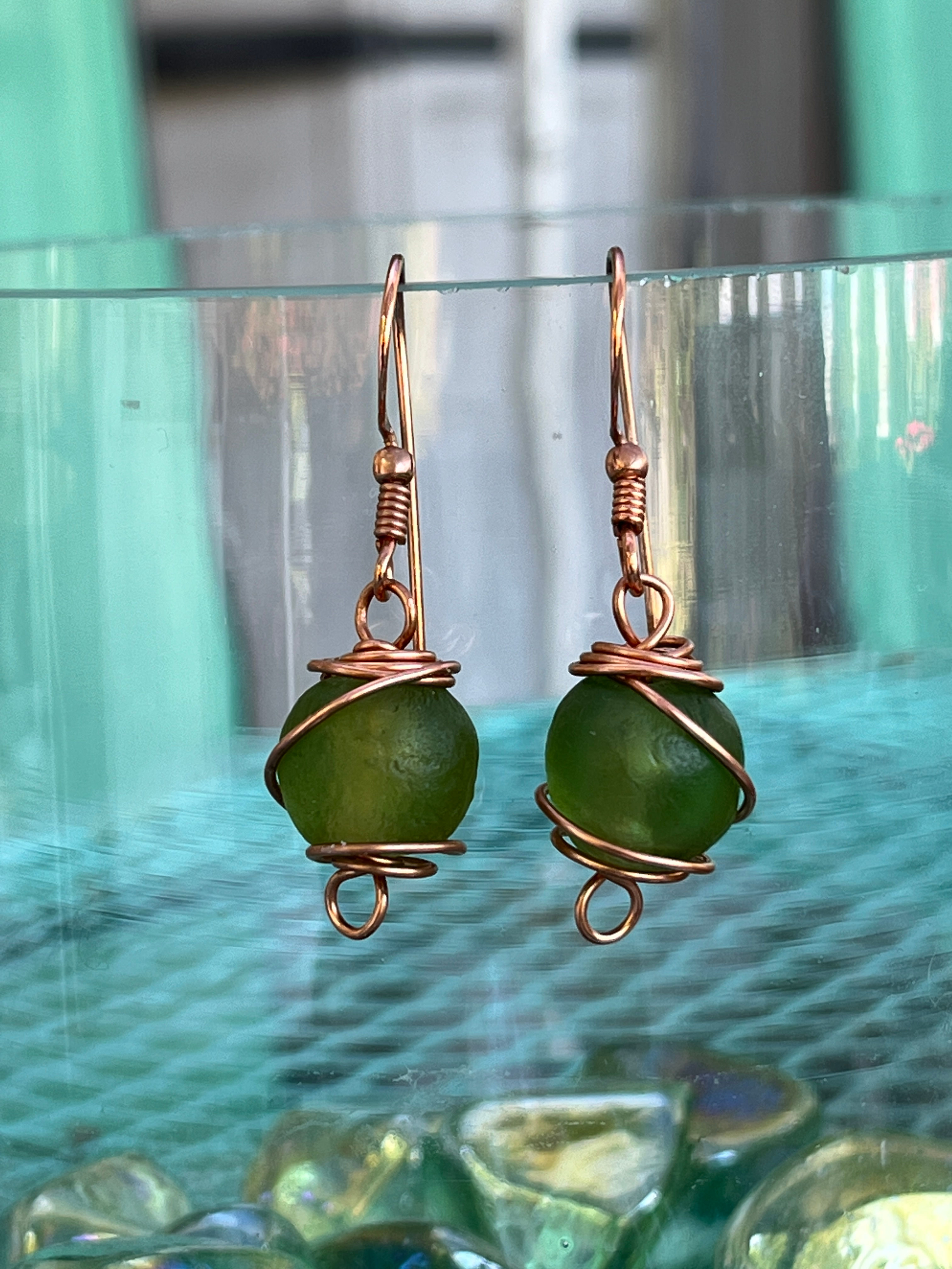 Copper earrings with wire wrapped green recycled glass bead