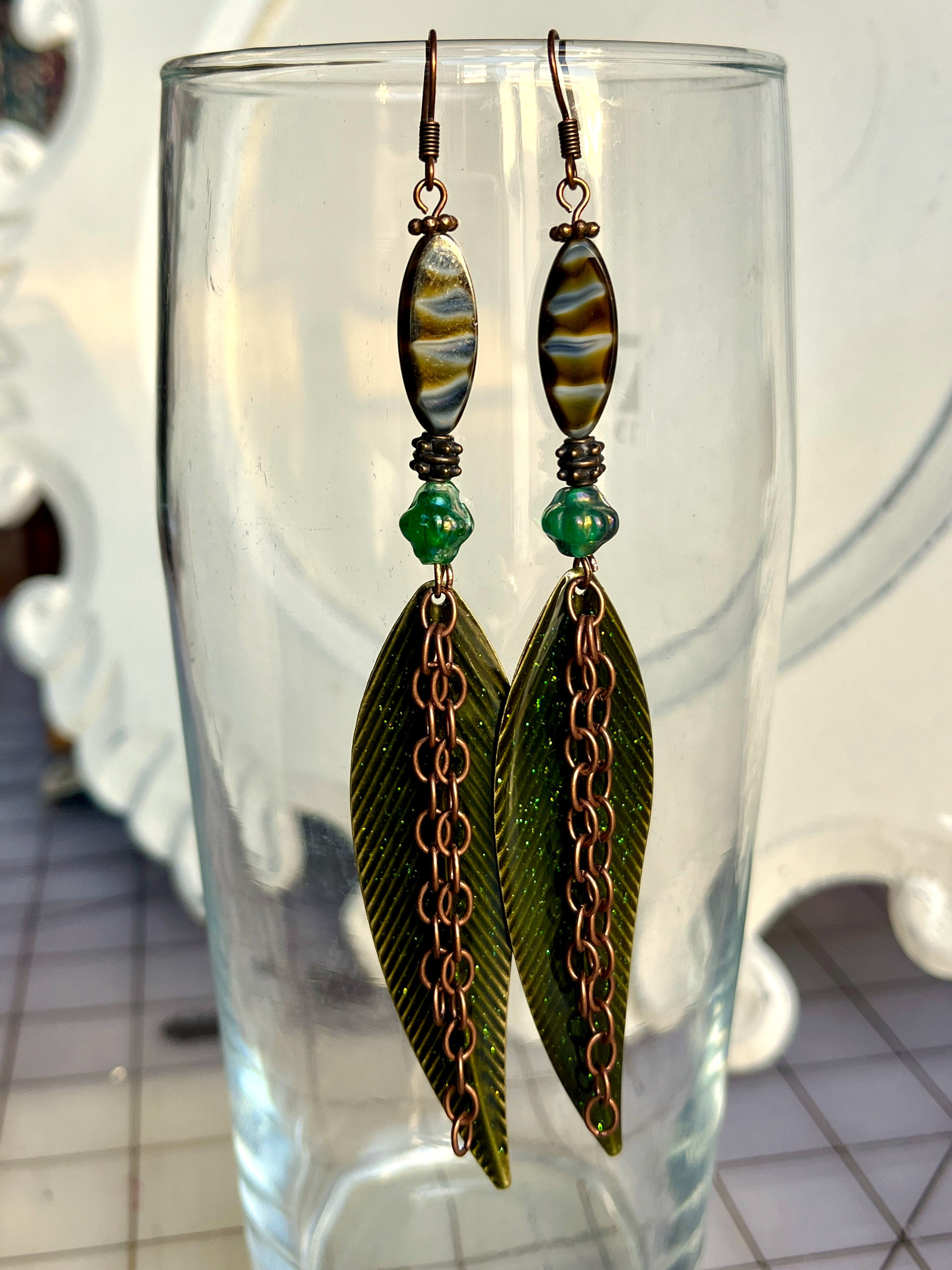 5" long green leaf earrings with copper and glass beads that sparkle