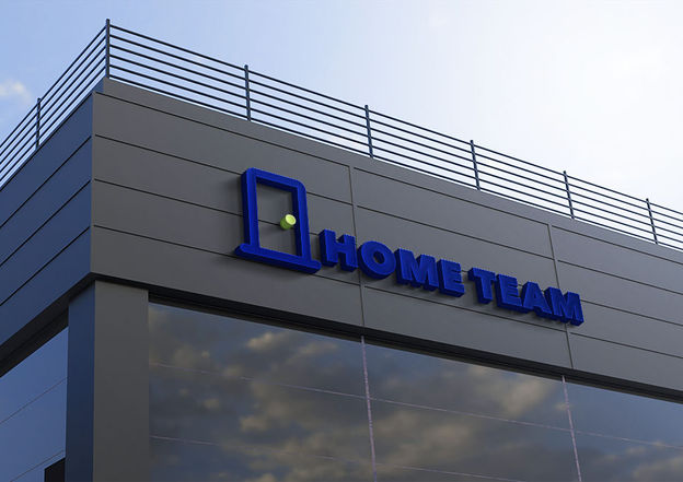 HomeTeam office exterior signage displaying professional corporate logo branding
