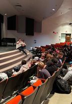 Ralph Fawaz speaks in an auditorium during a workshop