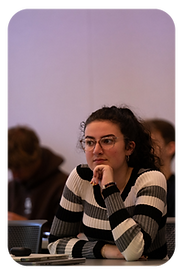 A student listening intently during a workshop
