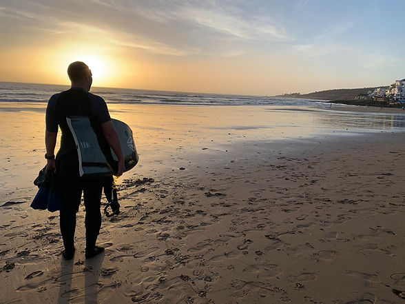 bodyboarder in Morocco sunset.