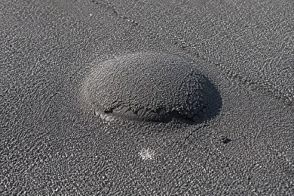 Blister forming on the surface of an SBS modified bitumen roof membrane