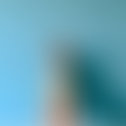 legs after getting laser hair removal against a blue wall