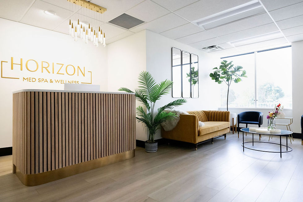 Horizon Med Spa Shawnee location waiting area with a brown couch and plants.